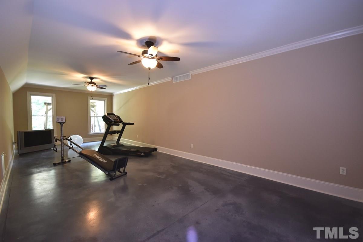 4012 Limerick Road Burlington, NC 27215 - Photo 21 of 24 a living room with furniture and a chandelier