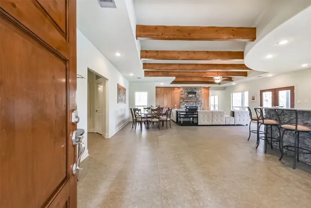 a room with lots of table and chairs