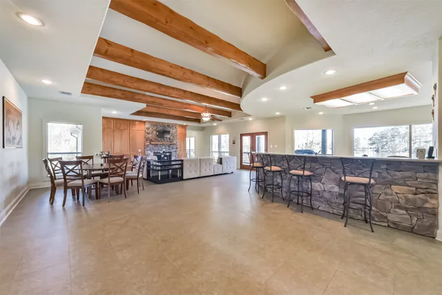 a dining room with furniture and a chandelier