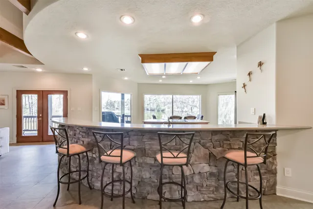 a large kitchen with a table and chairs