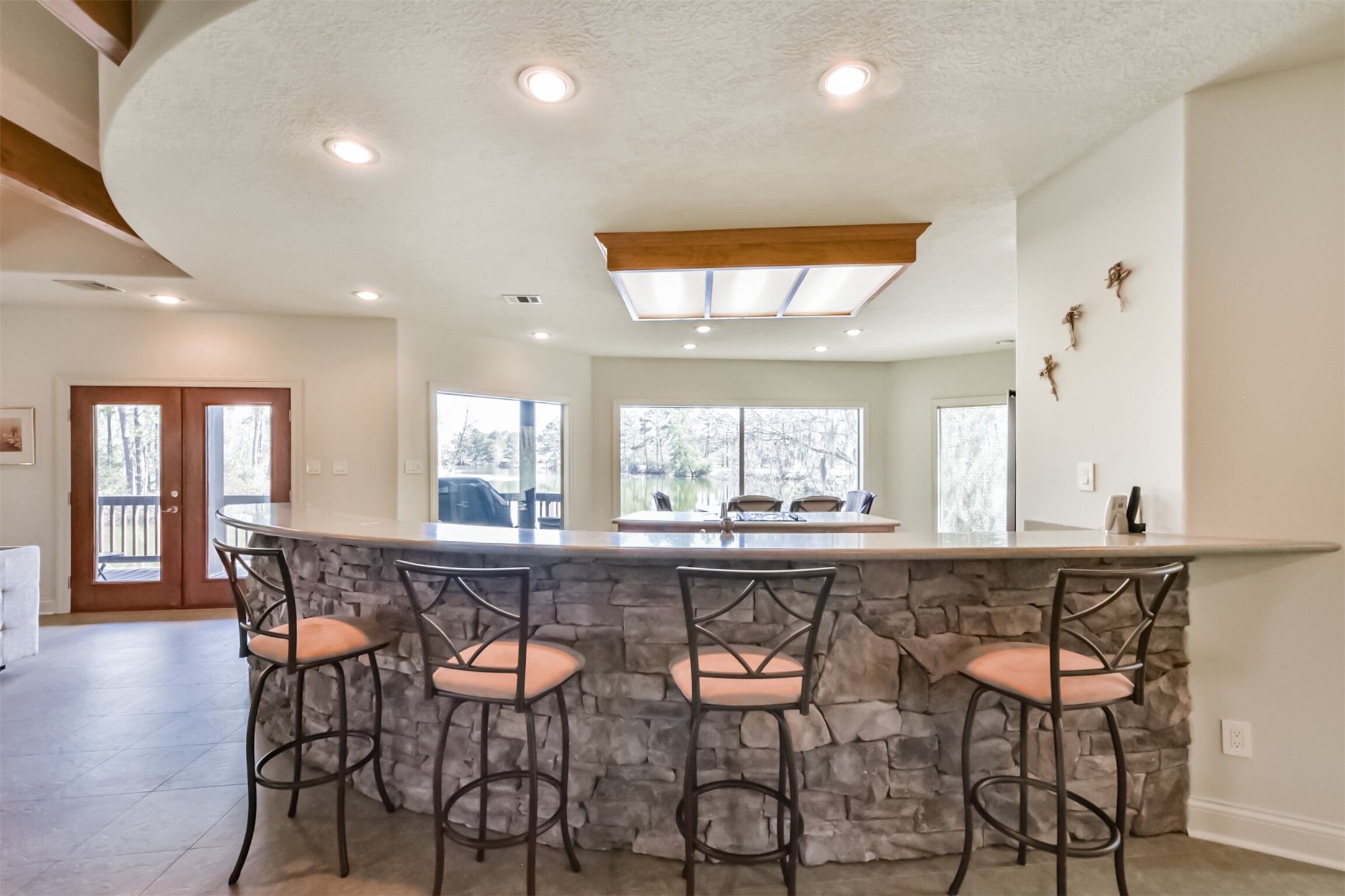 10 Raccoon Ramble Cleveland, TX 77327 - Photo 19 of 49 a large kitchen with a table and chairs