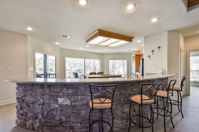 a kitchen with a table and chairs in it