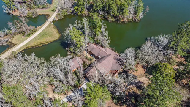 aerial view of a house with a lake view