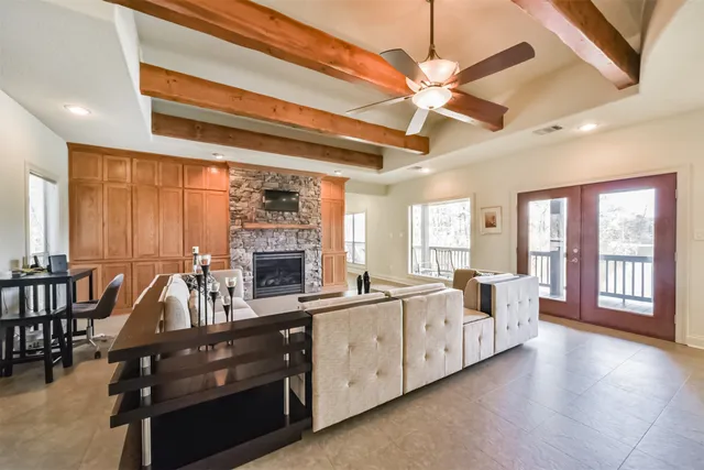a view of living room with furniture and fireplace
