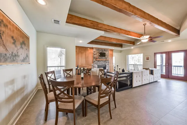 a view of a dining room with furniture and window