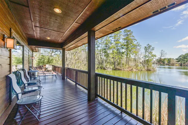 a view of balcony with couch and wooden floor