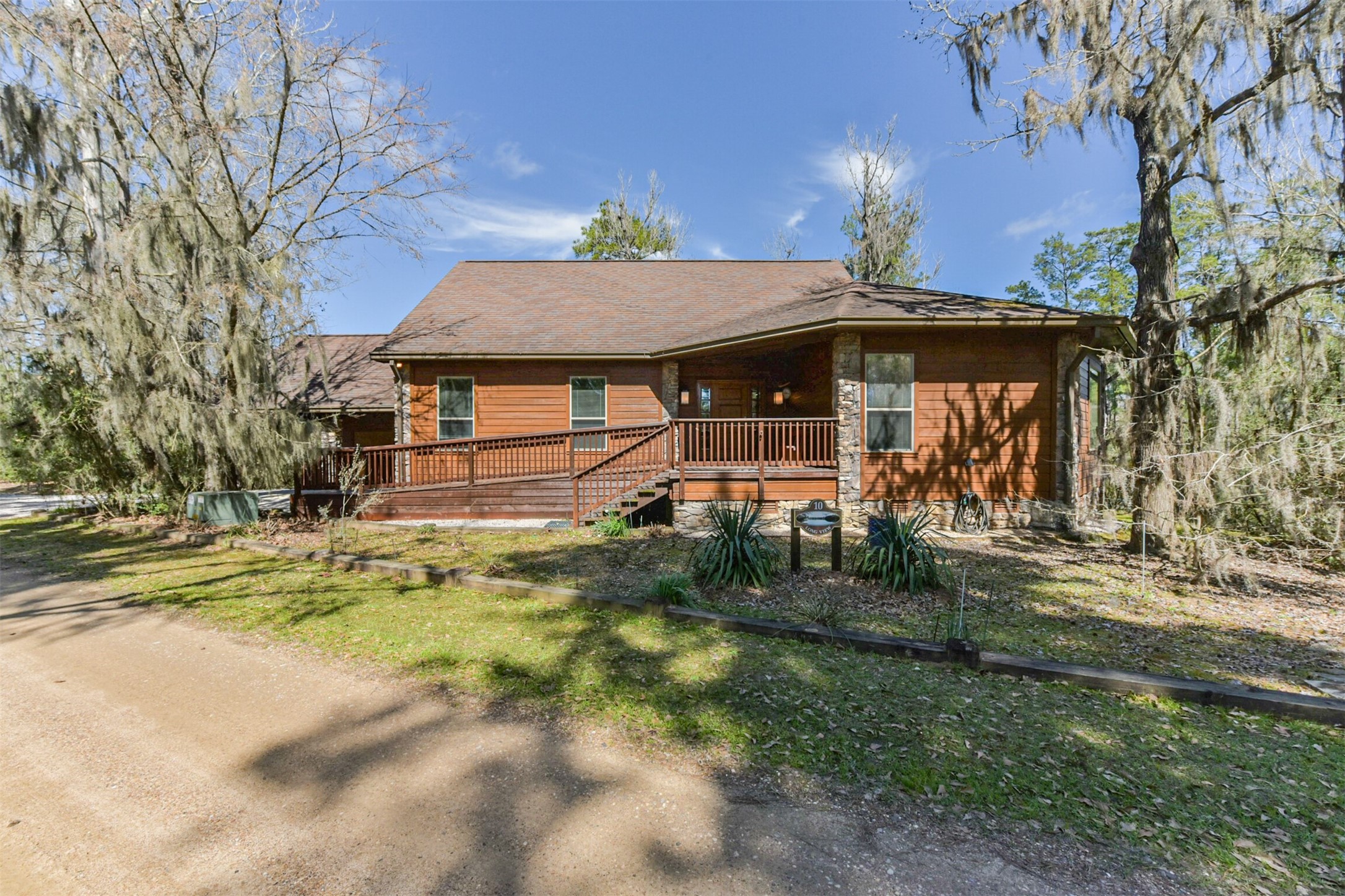 10 Raccoon Ramble Cleveland, TX 77327 - Photo 41 of 49 a front view of a house with a yard