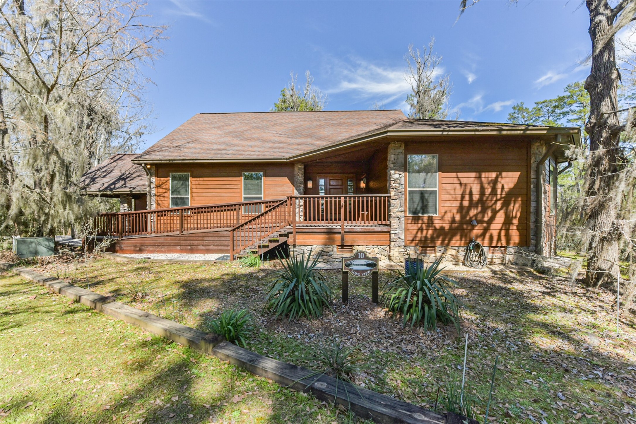 10 Raccoon Ramble Cleveland, TX 77327 - Photo 42 of 49 a front view of a house with a yard