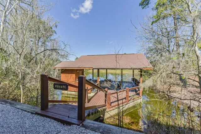 a view of a wooden deck with a yard