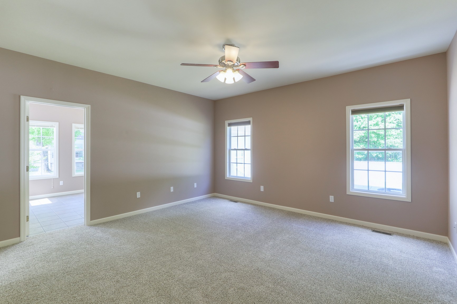 4630 Mt View Road Manchester, TN 37355 - Photo 18 of 25 an empty room with chandelier fan and windows