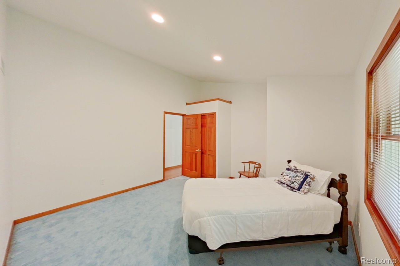 10201 Washburn Road Goodrich, MI 48438 - Photo 51 of 85 Spacious room featuring light blue carpeting, white walls, and recessed lighting