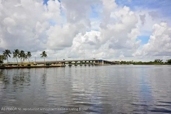 a view of a lake with boats in the background