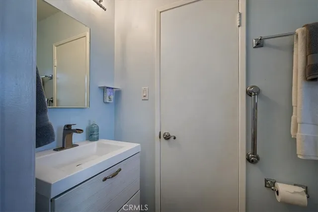 a bathroom with a sink toilet and vanity