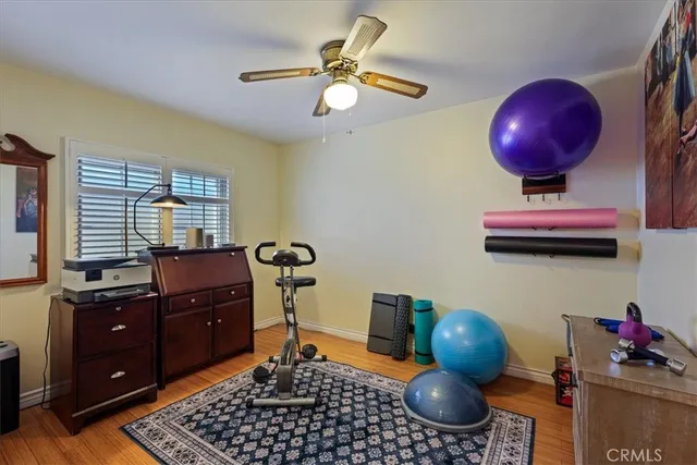 a kitchen with stainless steel appliances granite countertop a sink a stove and a wooden floors