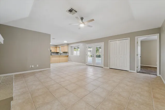a view of a livingroom with a furniture and a ceiling fan