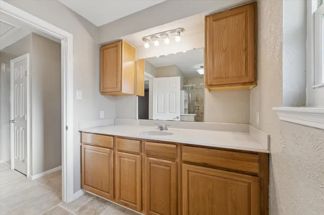 a bathroom with a sink and a mirror