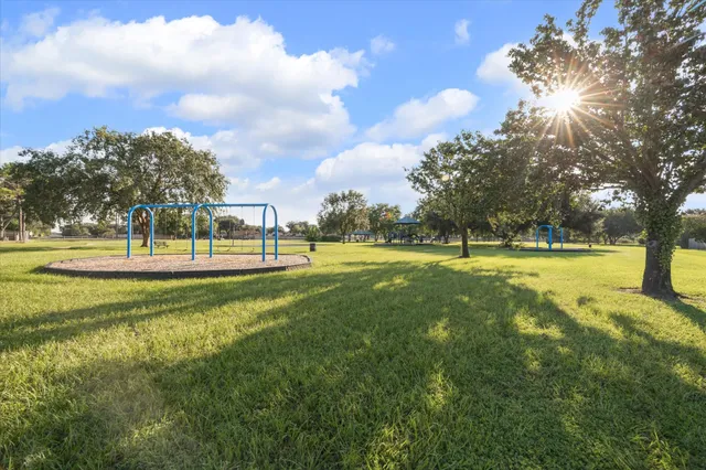 a view of a playground with basketball court