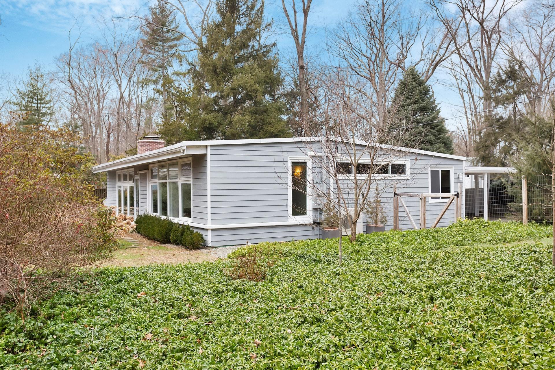 21 Princes Pine Road Norwalk, CT 06850 - Photo 5 of 27 a backyard of a house with table and chairs