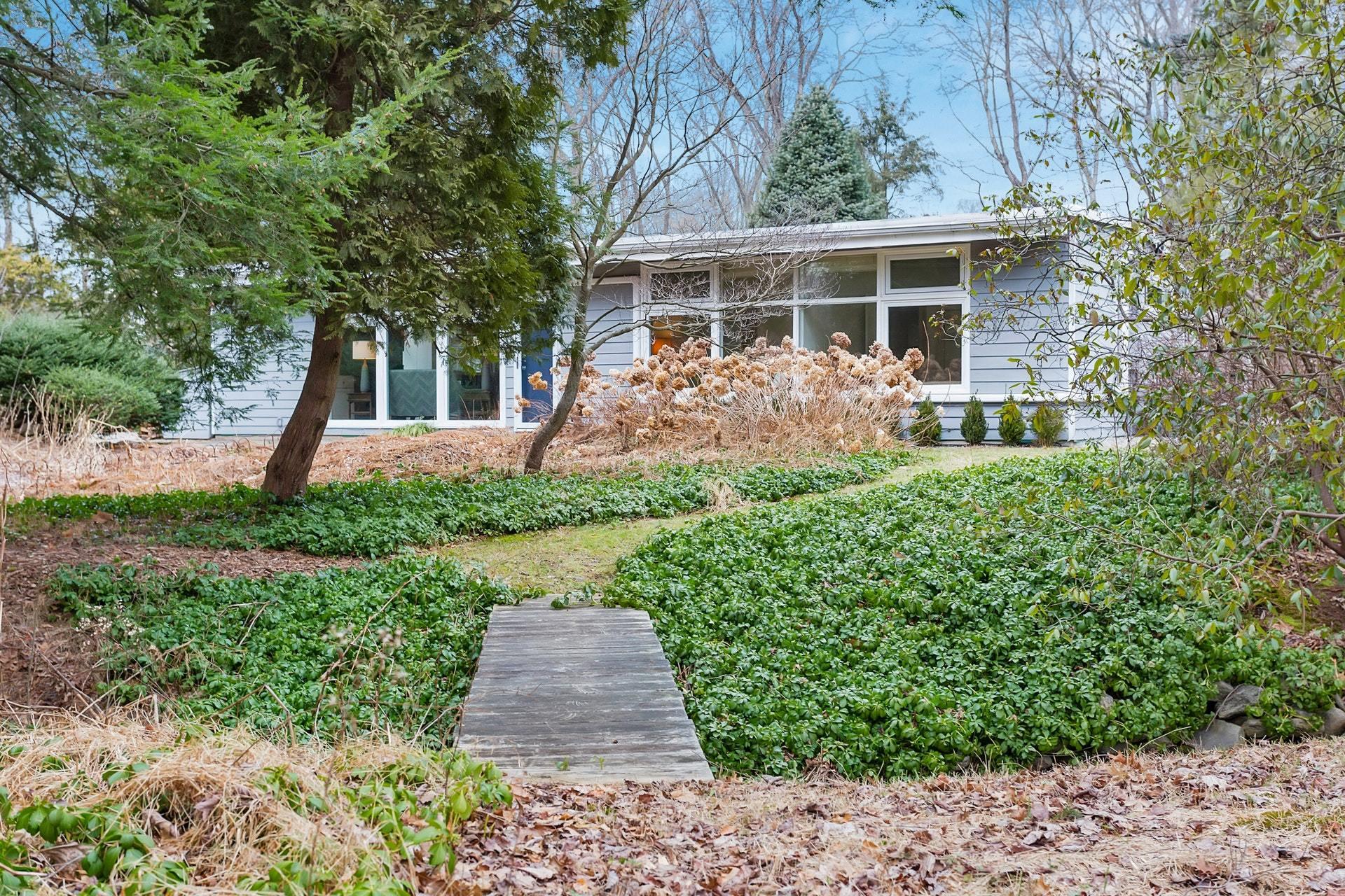 21 Princes Pine Road Norwalk, CT 06850 - Photo 7 of 27 a front view of a house with a yard and fountain