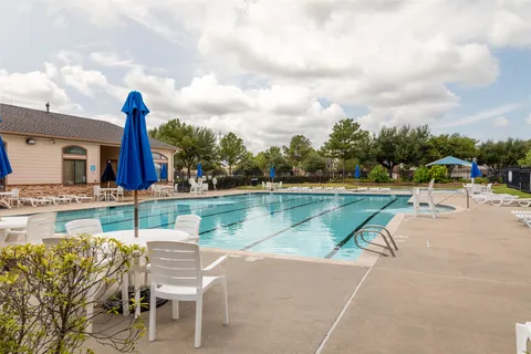 a view of a lake with a table and chairs