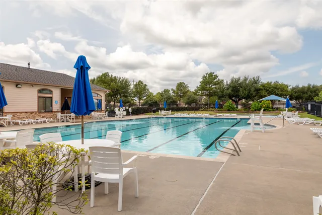 a view of a lake with a table and chairs