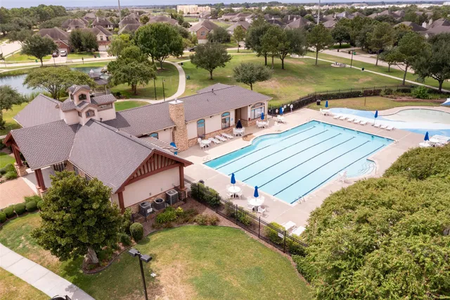 an aerial view of a house with a lake view