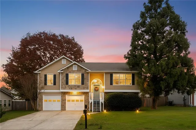 a front view of a house with a yard