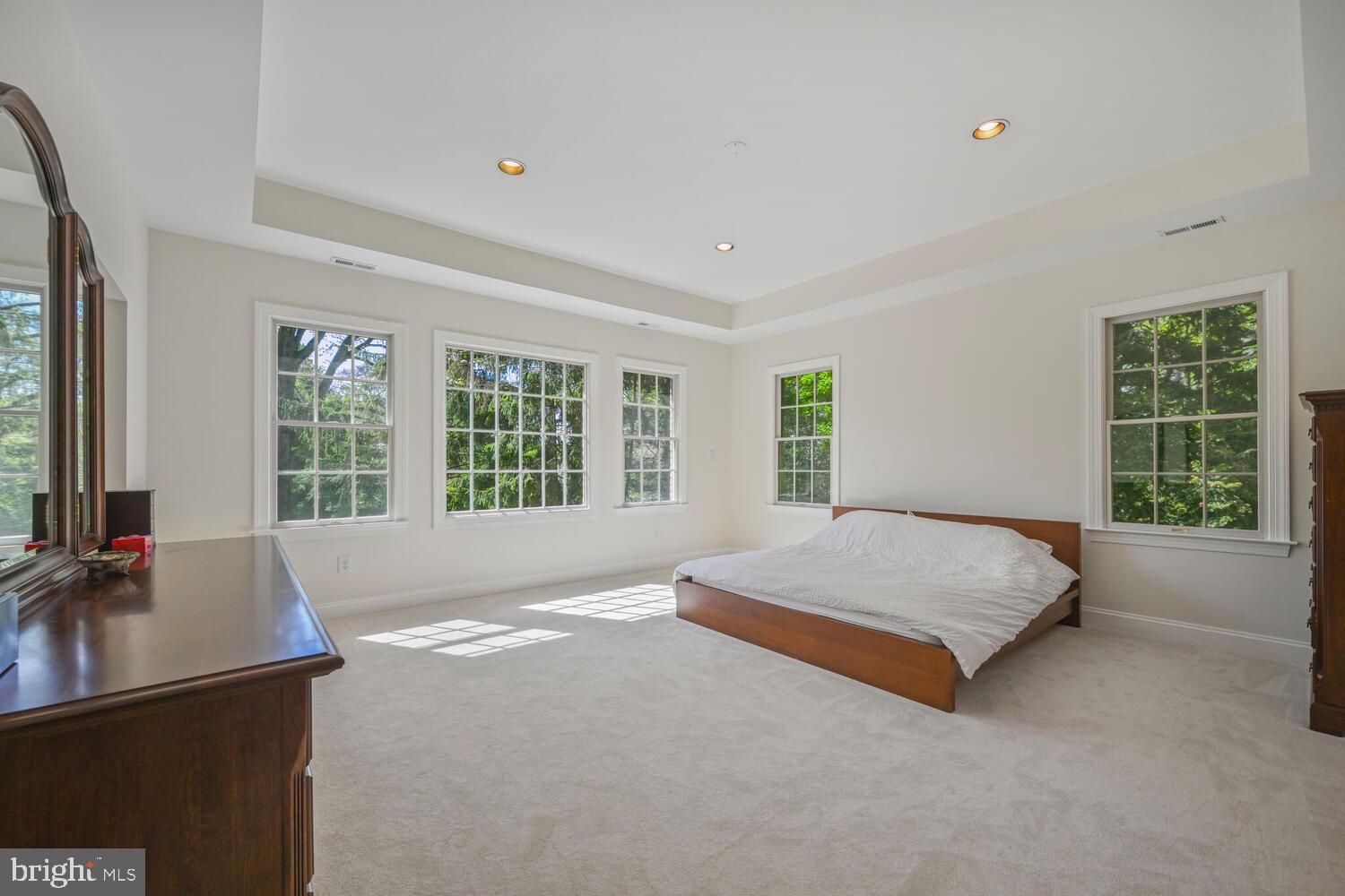 7401 Honesty Way Bethesda, MD 20817 - Photo 18 of 54 a spacious bedroom with a bed and a window