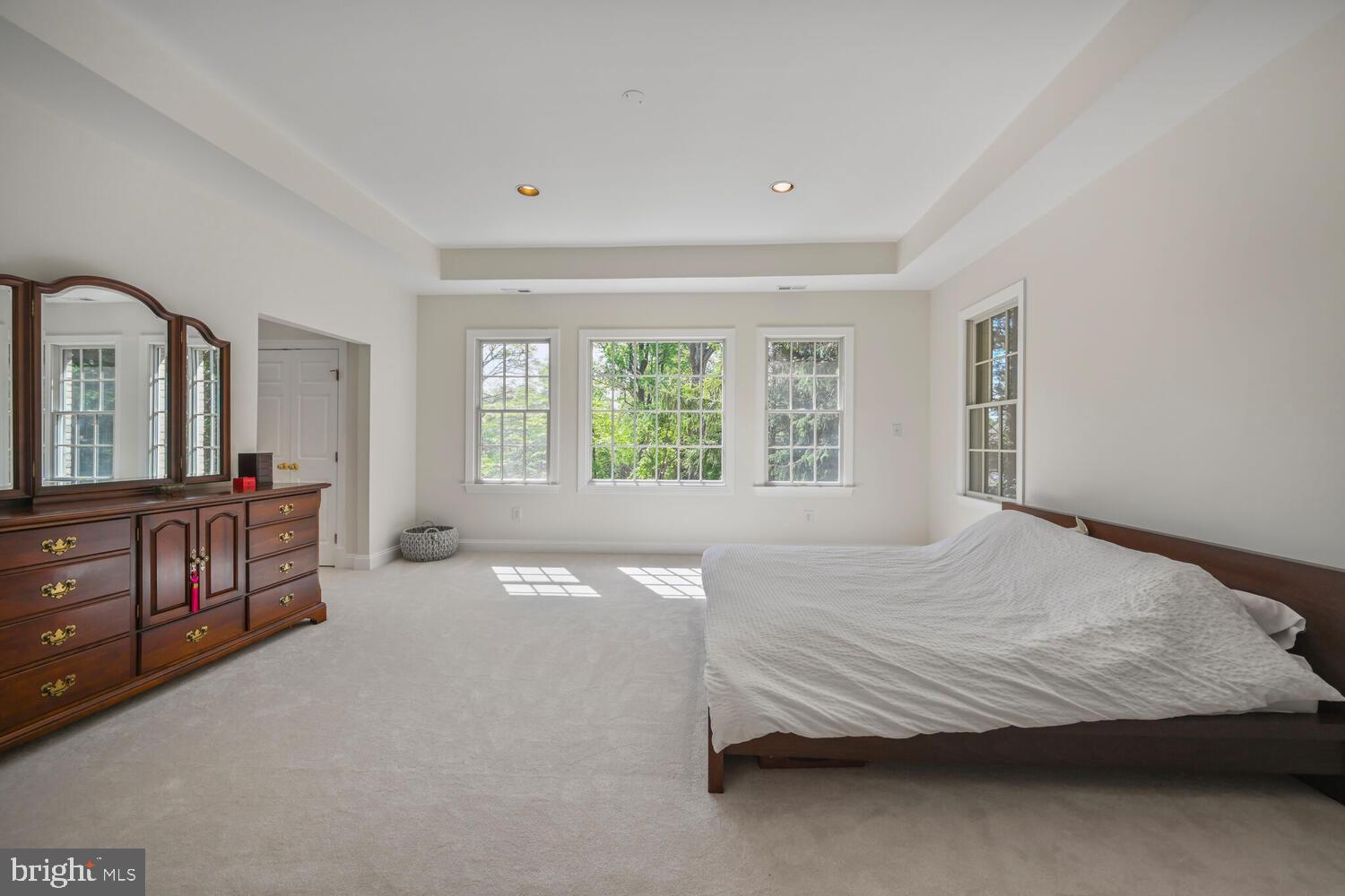 7401 Honesty Way Bethesda, MD 20817 - Photo 19 of 54 a bedroom with a bed and a dresser next to a window
