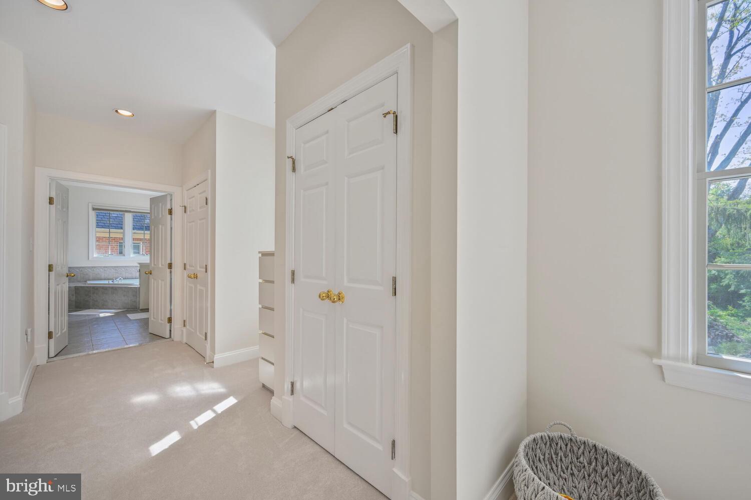 7401 Honesty Way Bethesda, MD 20817 - Photo 24 of 54 a view of a hallway with a livingroom and a dinning room