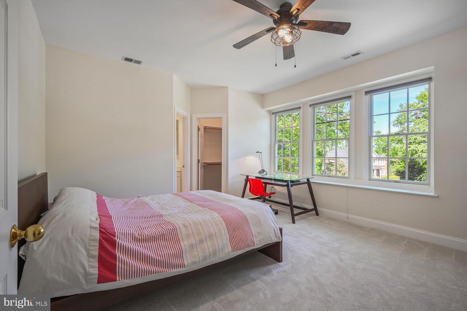 7401 Honesty Way Bethesda, MD 20817 - Photo 29 of 54 a bedroom with a bed and a chandelier