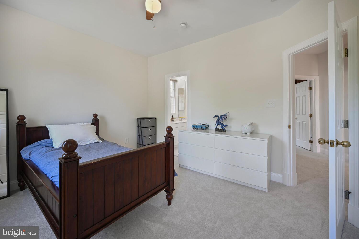 7401 Honesty Way Bethesda, MD 20817 - Photo 32 of 54 a room with a bed and a dresser