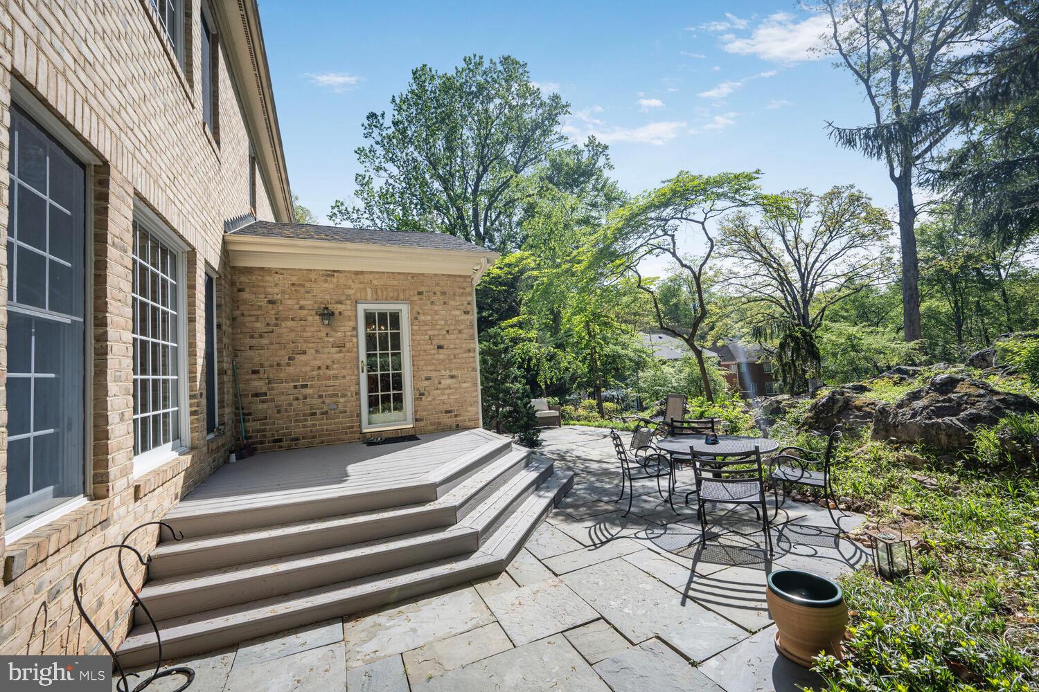 7401 Honesty Way Bethesda, MD 20817 - Photo 48 of 54 a view of a patio with chairs and potted plants