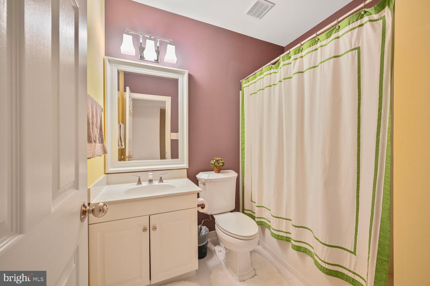 7401 Honesty Way Bethesda, MD 20817 - Photo 54 of 54 a bathroom with a sink a toilet and shower curtain