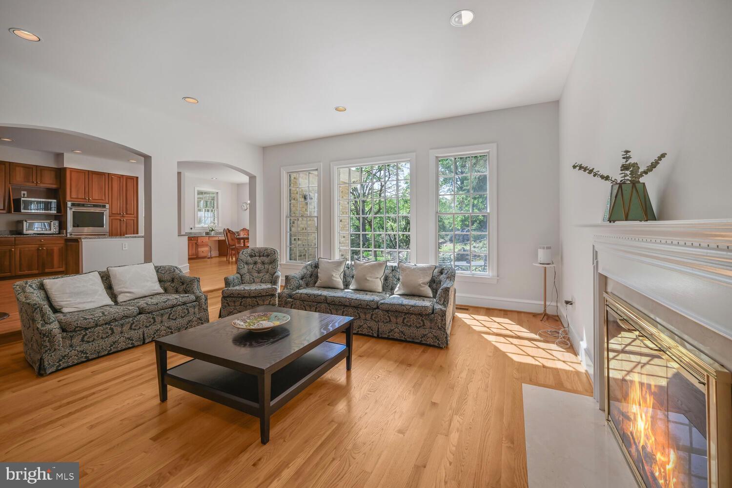 7401 Honesty Way Bethesda, MD 20817 - Photo 7 of 54 a living room with furniture and a fireplace