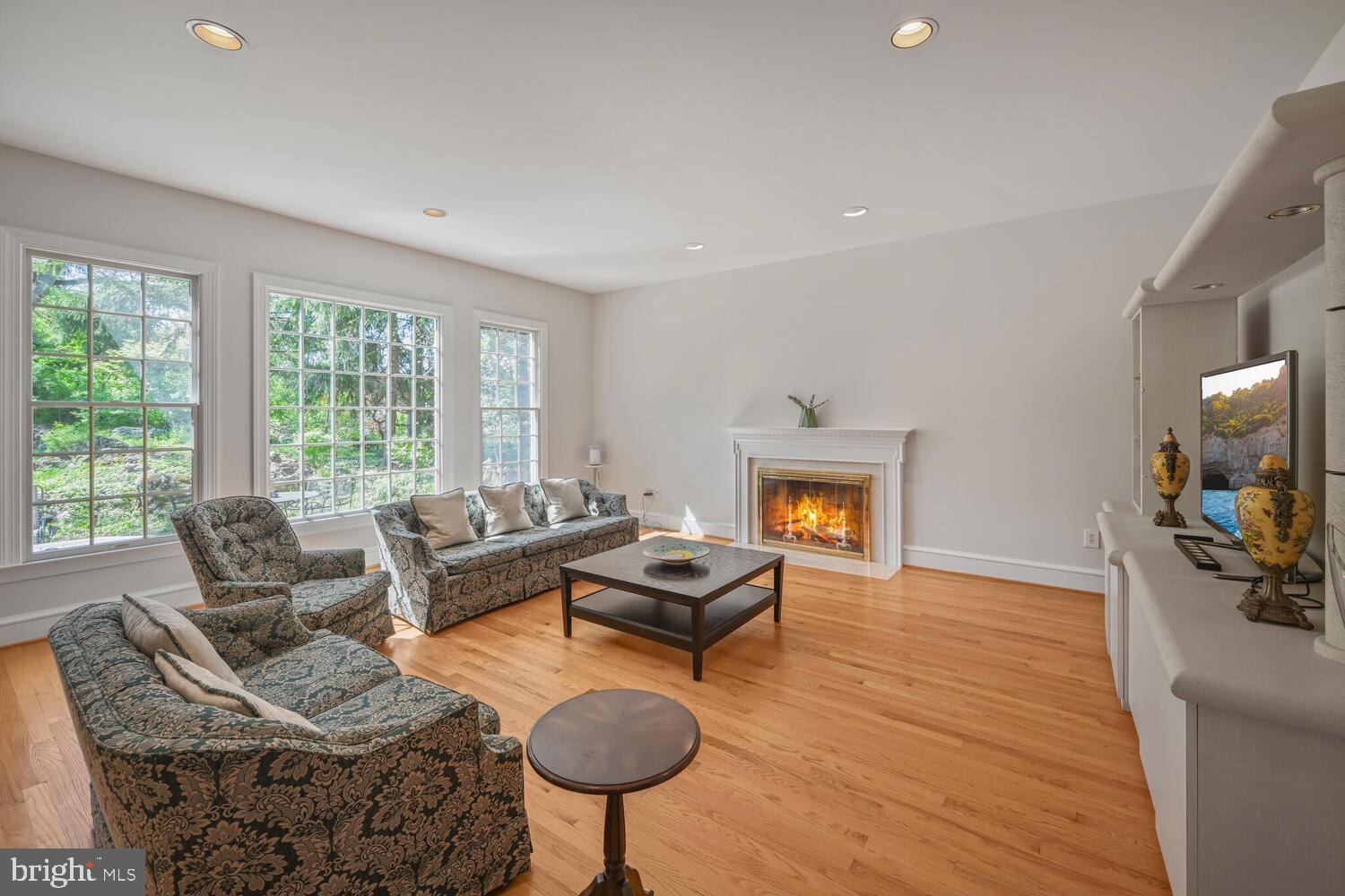 7401 Honesty Way Bethesda, MD 20817 - Photo 8 of 54 a living room with furniture and a fireplace
