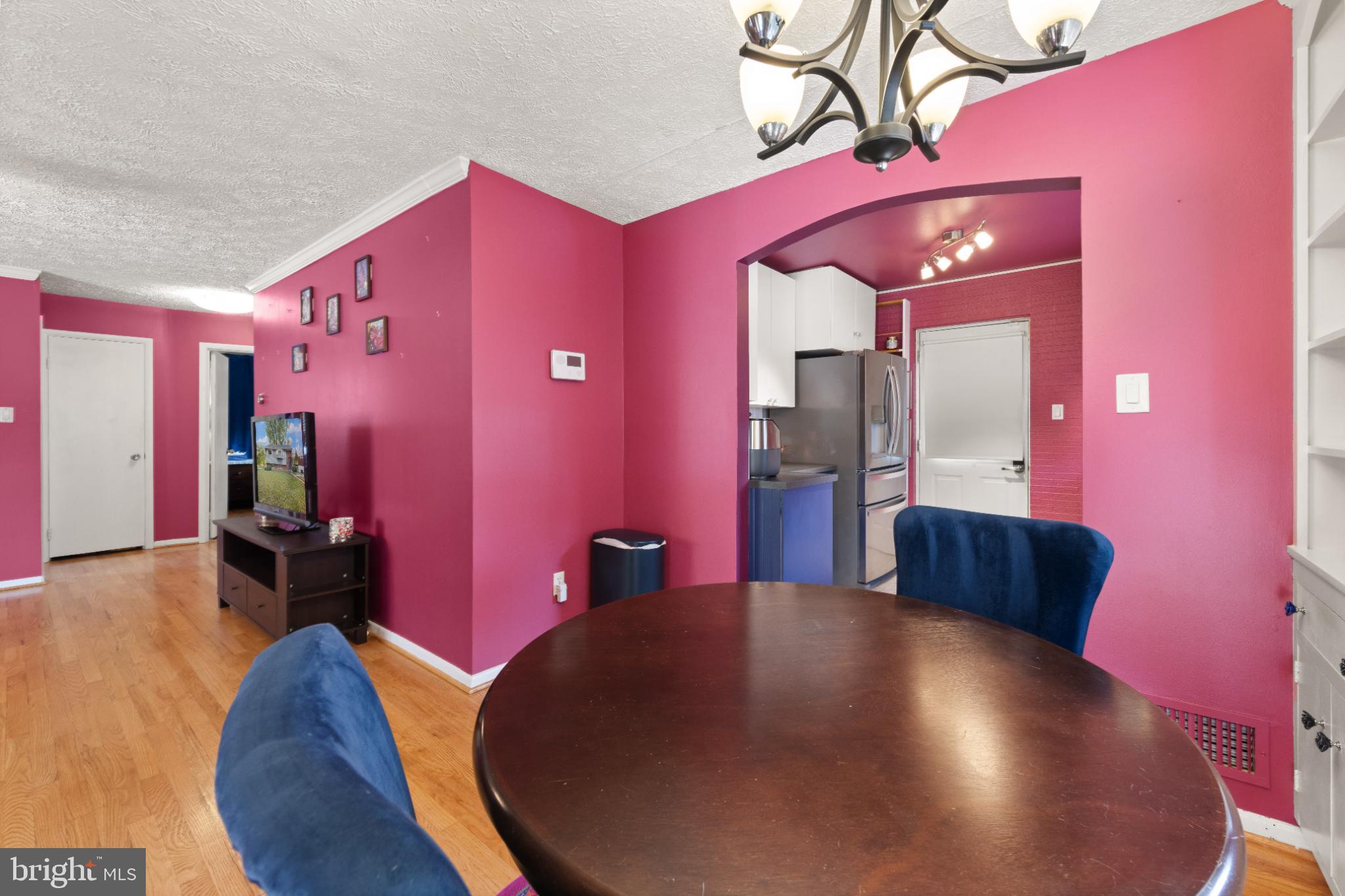 3700 Ralph Road Silver Spring, MD 20906 - Photo 12 of 30 Vibrant dining space with bold pink walls.