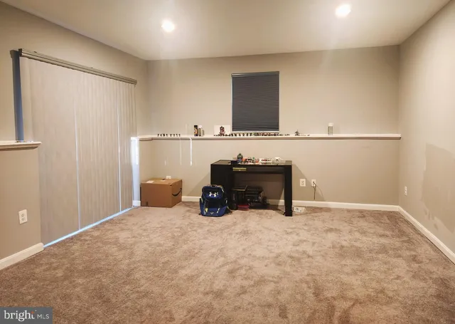 a view of a livingroom with chairs