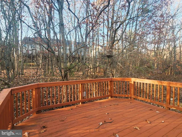 a wooden deck with trees