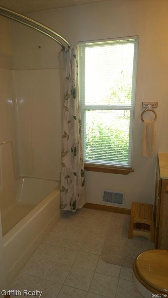 736 Fowlerville Road Fowlerville, MI 48836 - Photo 37 of 84 Ceramic Main Bath