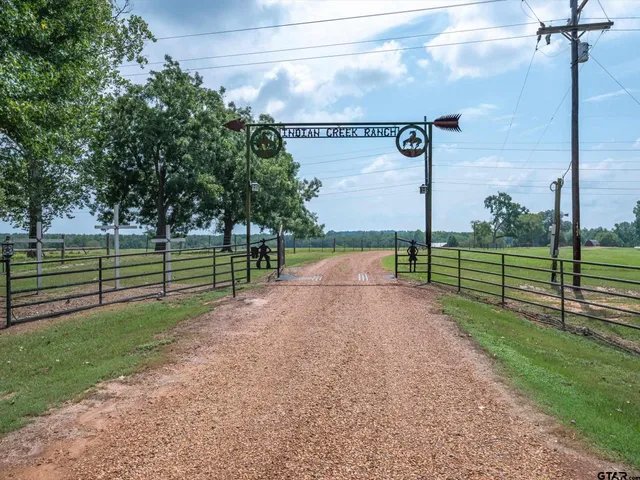a balcony with a table and chairs