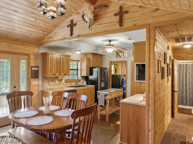 a view of a house with a yard porch and furniture