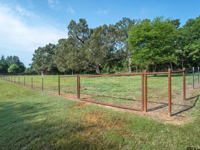 a view of a house with backyard porch and sitting area