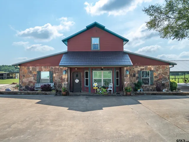 a view of a dining room with furniture wooden floor and chandelier