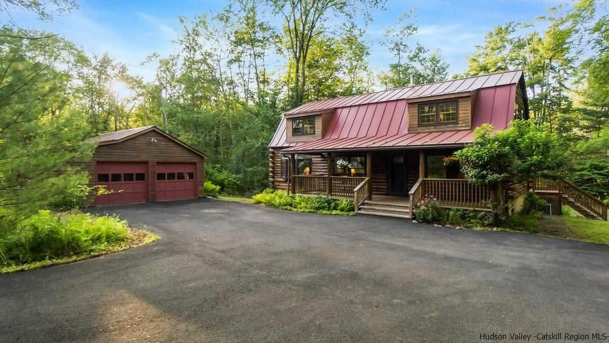 296 Bush Road Stone Ridge, NY 12484 - Photo 1 of 27 a view of a house with a cars park next to a road