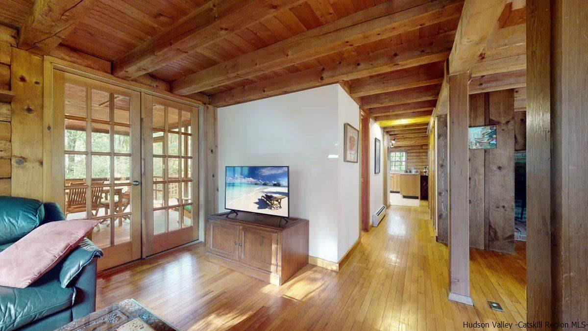 296 Bush Road Stone Ridge, NY 12484 - Photo 14 of 27 a living room with furniture and a wooden floor