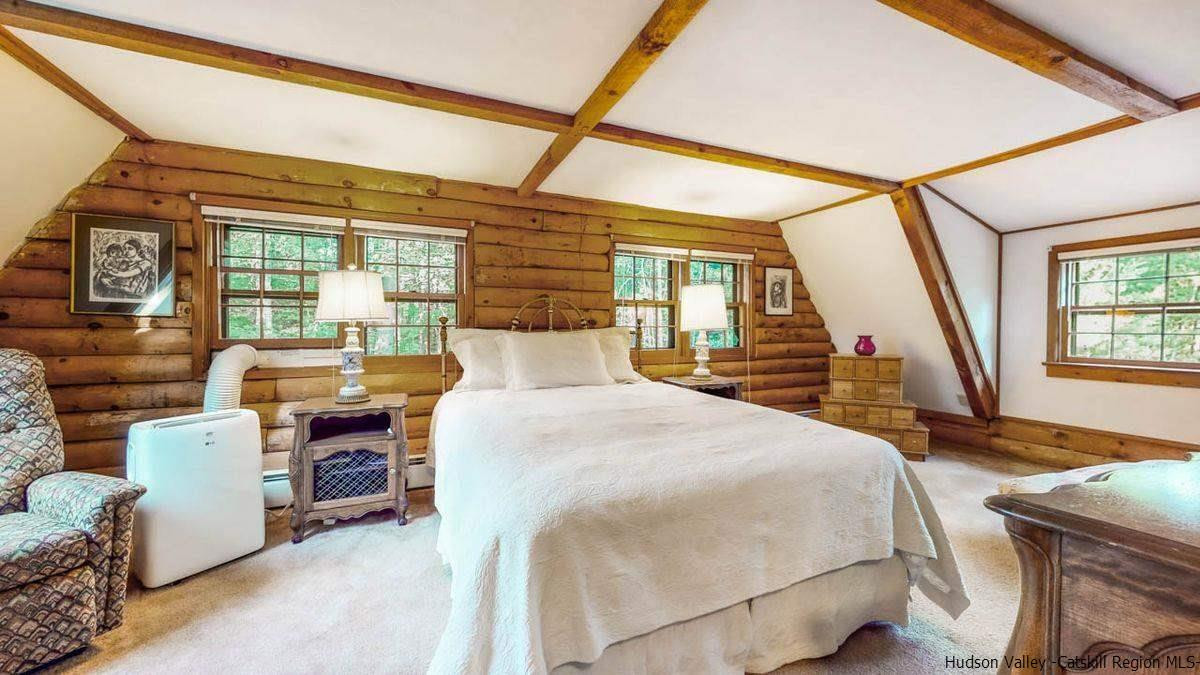 296 Bush Road Stone Ridge, NY 12484 - Photo 18 of 27 a bedroom with bed and wooden floor