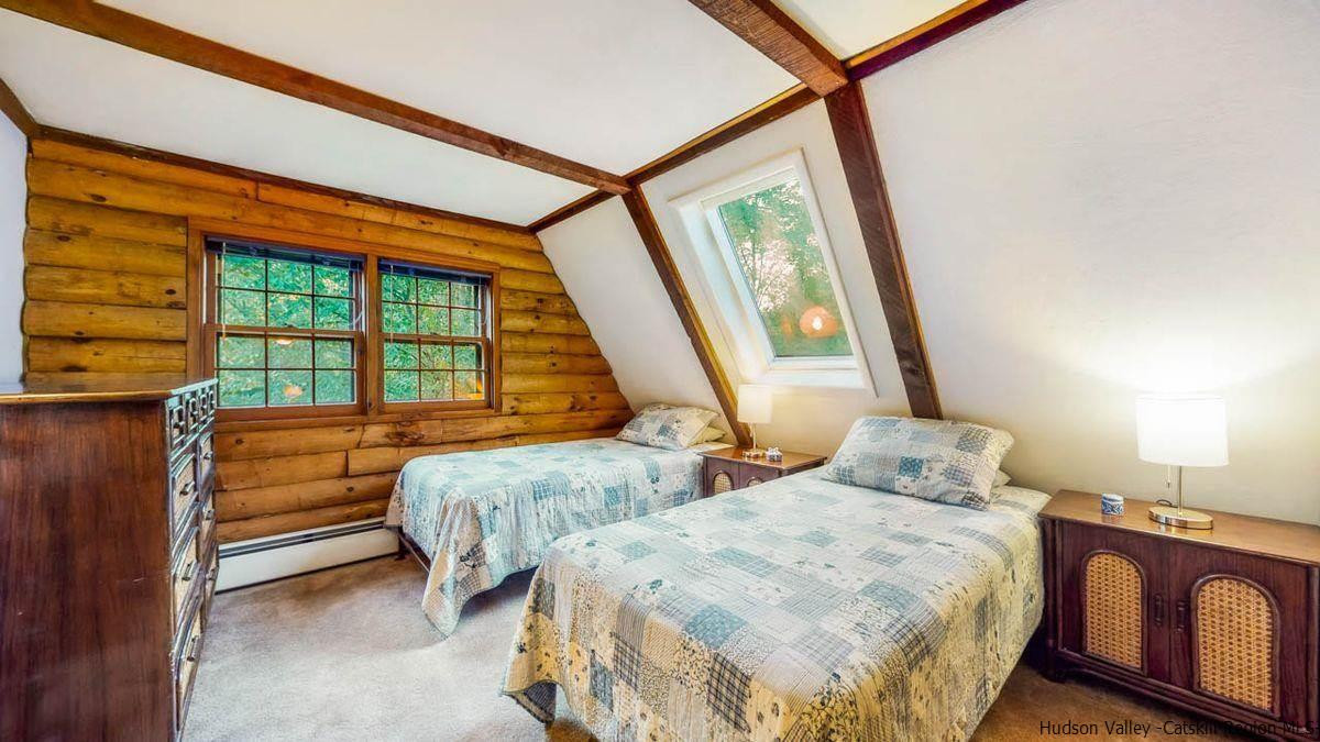 296 Bush Road Stone Ridge, NY 12484 - Photo 19 of 27 a bedroom with two beds and a large window