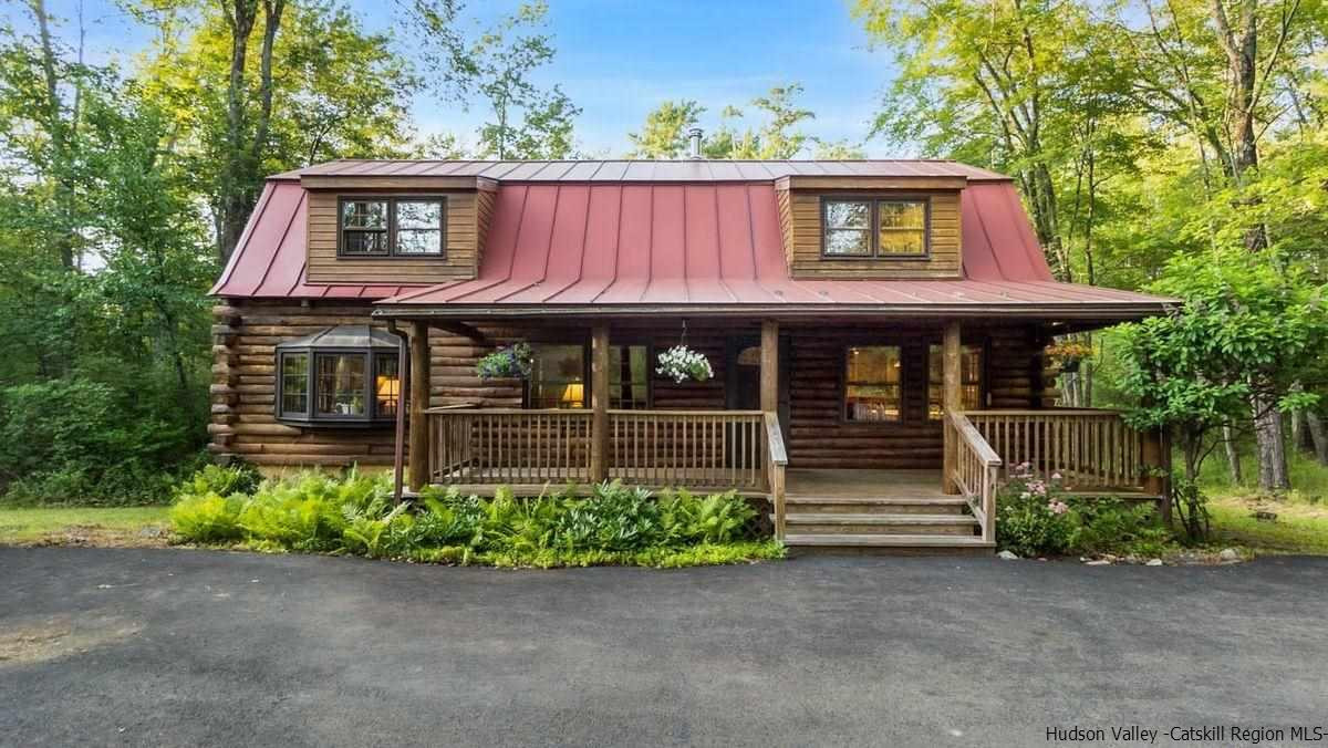 296 Bush Road Stone Ridge, NY 12484 - Photo 2 of 27 a view of a house with a small yard plants and large tree