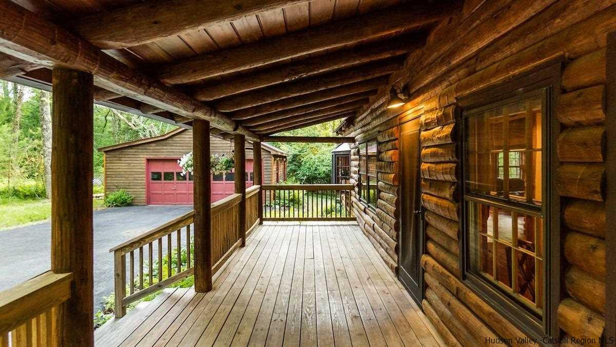 296 Bush Road Stone Ridge, NY 12484 - Photo 3 of 27 a view of a porch with wooden floor